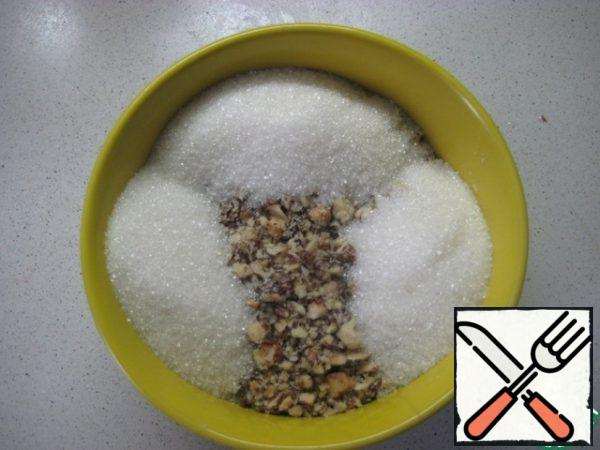 For the filling: lightly chop walnuts, combine with sugar, mix.
