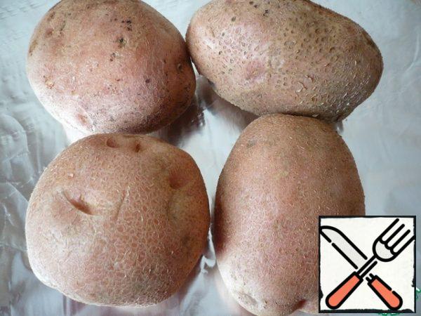 To prepare the dish, take four large potatoes.