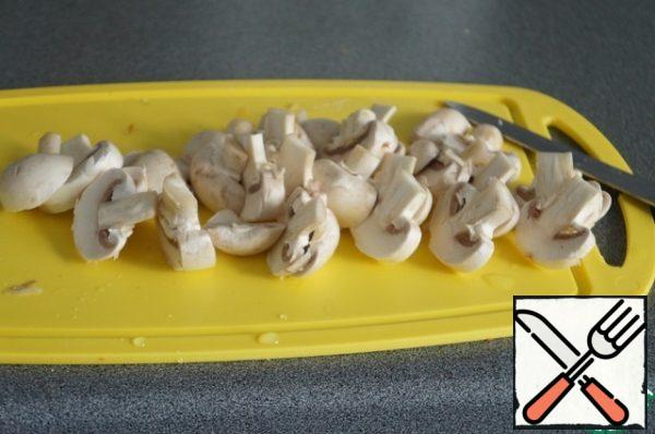 Cut the mushrooms, dip them in salted water, cook for a couple of minutes.
