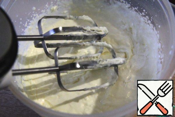 Beat eggs with sugar and salt until fluffy about 5-10 minutes. Add softened butter (can be combined in equal proportions vegetable and butter)
