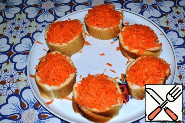 Put the pickled carrots on top and press lightly too.
