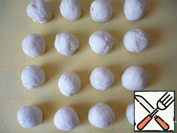 From each piece of dough roll balls, cover with cling film and leave for a while.