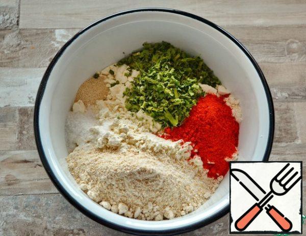 Mix in a bowl both types of flour, salt, dry yeast, dried herbs and paprika.Greens can take any to your taste. I have dried parsley and green onions
