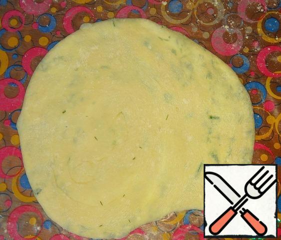 Then roll out into a tortilla 1.5 cm thick.
