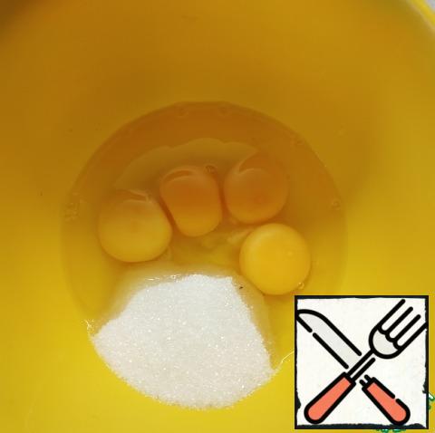 Beat eggs with sugar until light.
