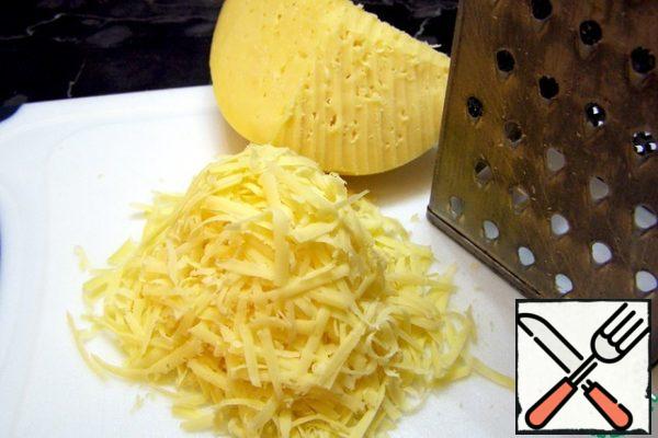 Grate cheese on a coarse grater.