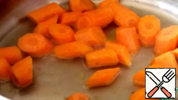 Cut the carrots into pieces and boil them like potatoes.
