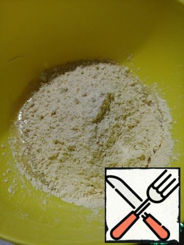 In a bowl, add the eggs, flour, salt and sour cream and whisk.