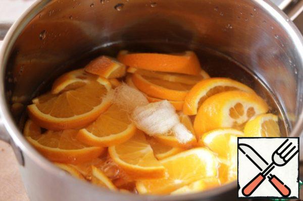 Weigh the pan in which you will cook the jam, and record its weight.
Fold the sliced oranges into a saucepan, cover with cold water, fold the bones into cheesecloth and add to the oranges. Leave it all overnight (or for 12 hours).