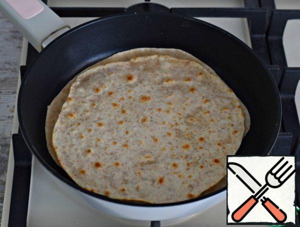 ... and again turn. Tortillas are very thin, cooked instantly!