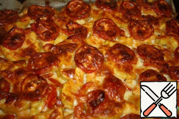 Remove the baking sheet and sprinkle with grated cheese. Bake for another 20 minutes until golden brown.