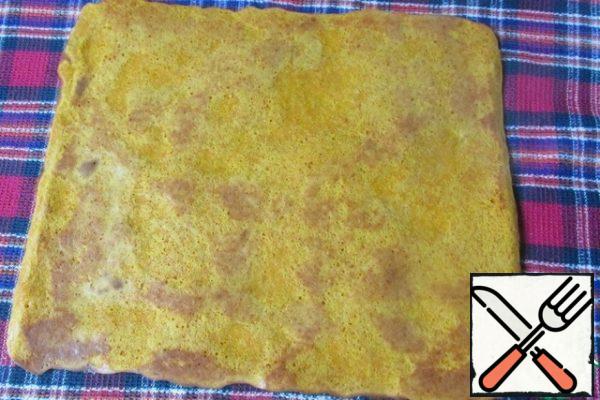 Put a baking sheet in a preheated oven and bake a layer of dough for about 15 minutes. Remove from the baking sheet along with a sheet of parchment, turn on a towel parchment up and gently remove it.