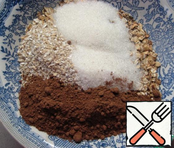 Combine Golden oat flakes, oat bran, cocoa and sugar. Stir.