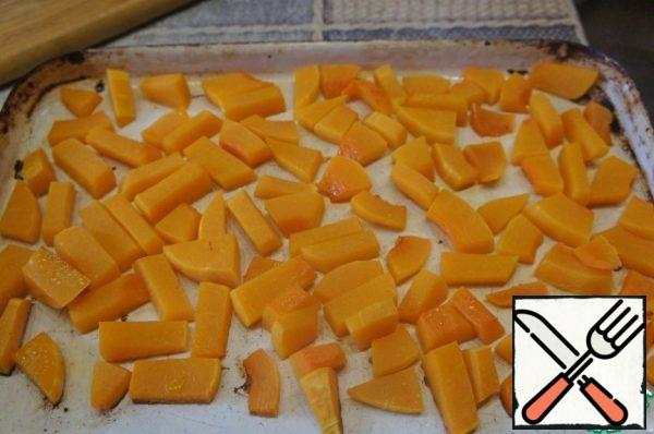 Peel the pumpkin from the skin and seeds, cut it into cubes or slices, put on a baking sheet and bake in the oven for 20 minutes until tender.