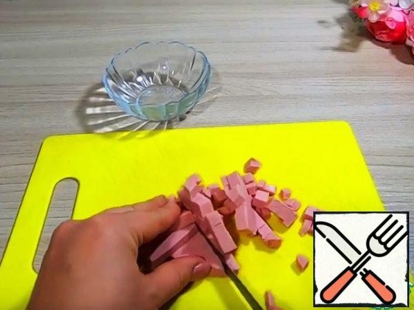 Cut the sausage into small pieces
