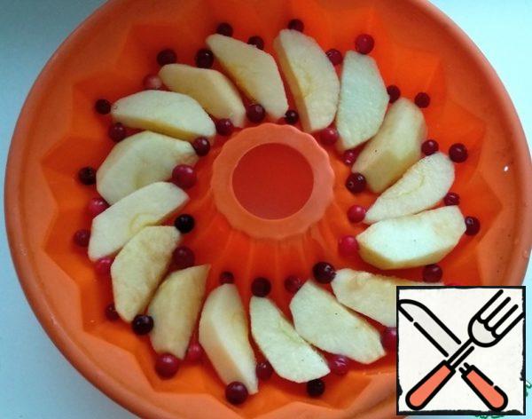 Arrange the apples and cranberries in a baking dish (I have silicone).