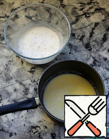 Add the melted butter to the egg mixture and beat with a mixer.