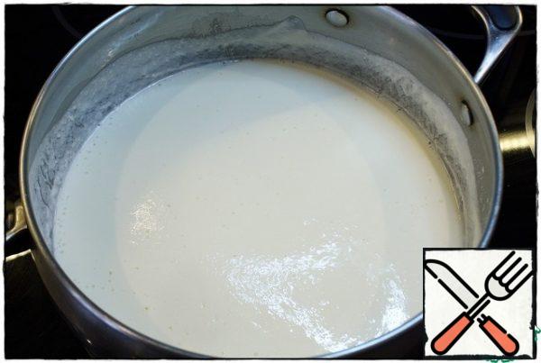 Give the sour cream to boil. Add a little salt, as the dish will be present salted cheese.