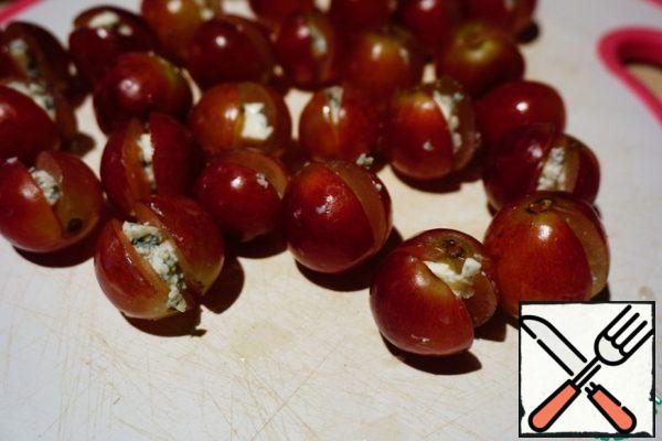 Instead of seeds, put a piece of cheese in each grape.
