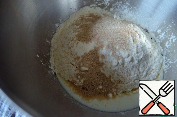 Add the sifted flour, sugar, yeast.
