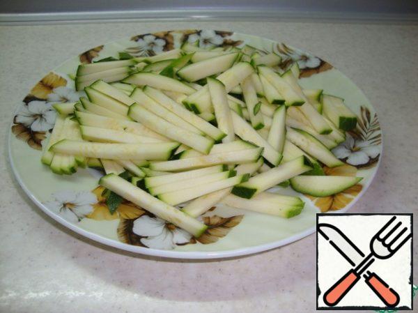 Zucchini cut into strips.