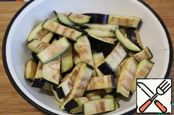 Rinse the eggplant from the salt and send it to the microwave for 3 minutes - or just boil for a minute in boiling water and squeeze-the eggplant will take a minimum of oil when frying and cook quickly.