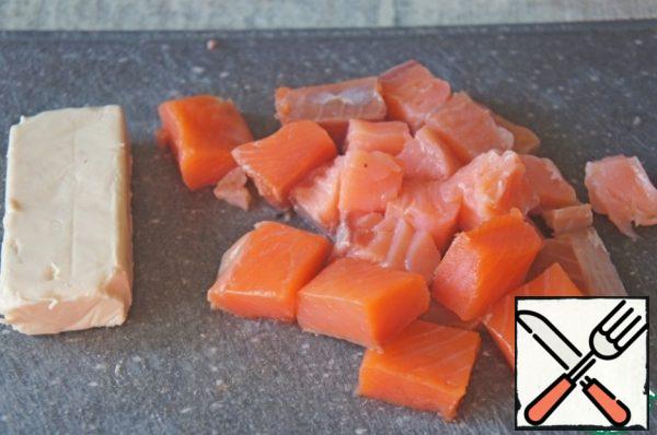 Carefully remove the salmon from the bones and cut into cubes.
