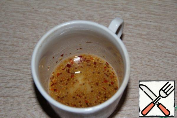 Prepare the marinade by mixing oil, lemon juice, salt, sugar, mustard.
