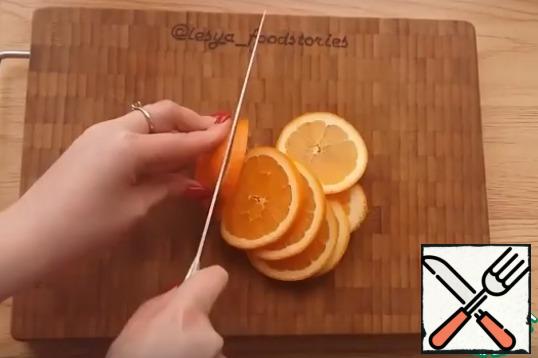 Orange cut into circles. Circles can be cut in half or into 4 parts.