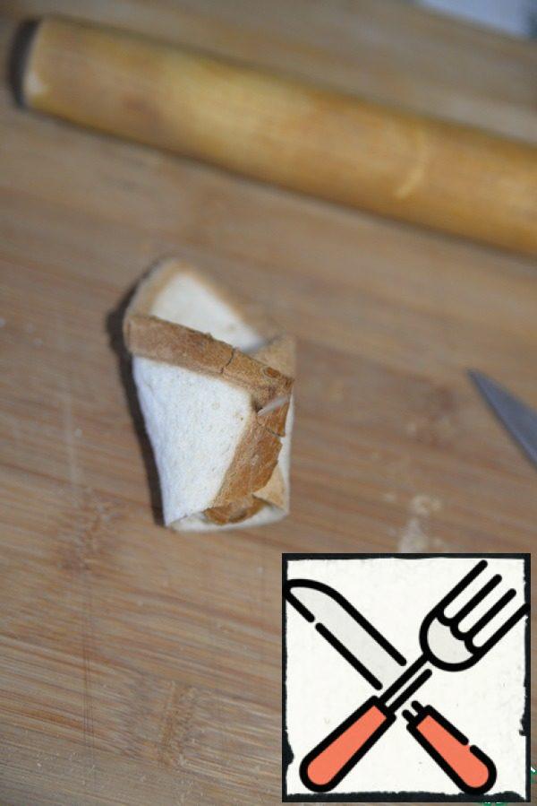 Fold the toast, secure with a toothpick.