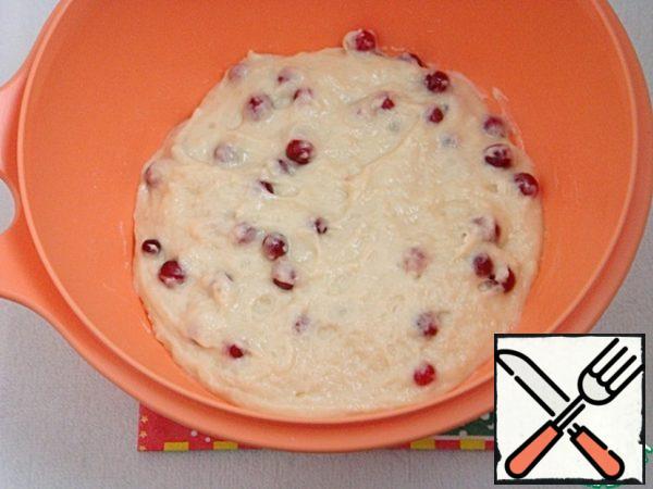 Stir only with a spoon until all the ingredients are mixed. Add the berries and gently knead the dough.
