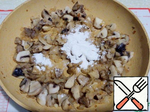 Add butter, flour, stir and fry for a minute, stirring occasionally.
