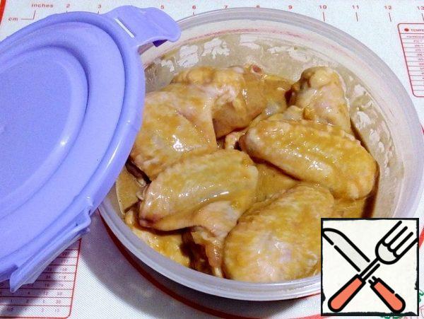 Stir the chicken wings in the prepared mixture, cover and allow to marinate in the refrigerator for at least 4 hours.