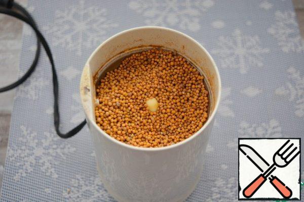 Half of these mustard seeds grind in a coffee grinder, leave the rest intact.