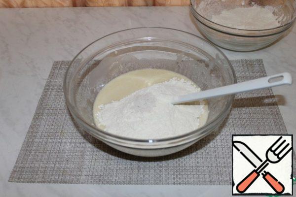 Gradually add flour, salt and knead the dough.