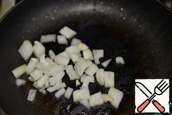 Onions cut into small cubes and fry until transparent in vegetable oil.