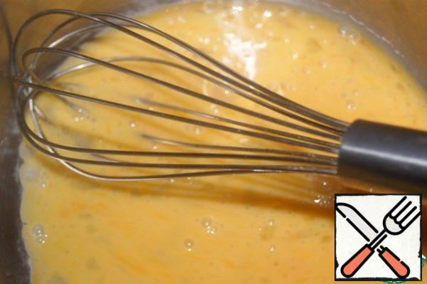 Beat the eggs with zest, starch and sugar.
