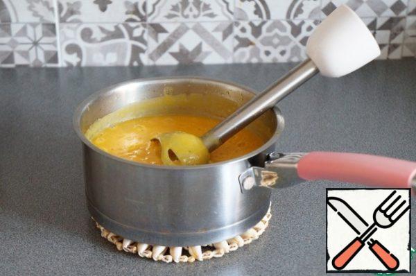 Chop the pumpkin, beans and vegetables into puree using a blender. Return the pan to the stove and heat it up a little.

