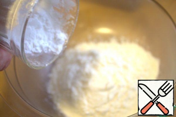 For batter in a bowl pour flour and starch.