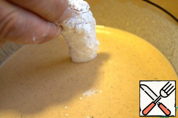 Dip the chicken pieces after the starch into the batter.