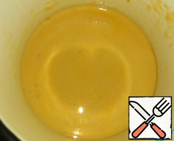 Pour a little milk, stir with a whisk breaking lumps. Add the rest of the milk in a thin stream, stirring with a whisk. Salt (take into account the salinity of the cheese! I added one small pinch of salt).