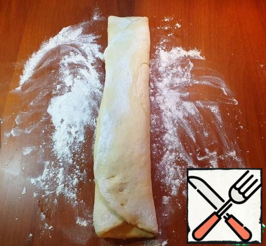 Fold the dough along the length.