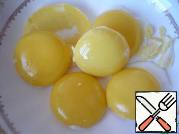 Then take out the yolks and transfer to a bowl.