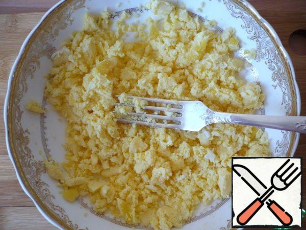 Mash the yolks with a fork