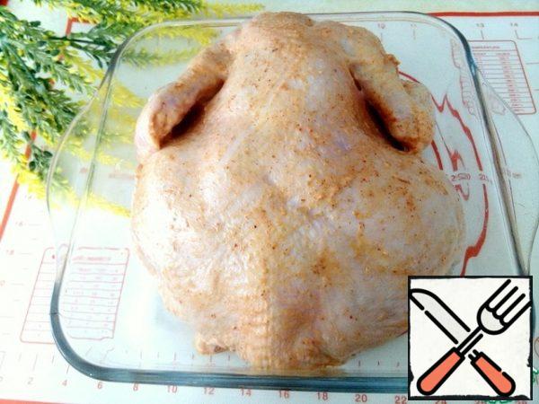 Chicken pre-wash, dry well with paper towels, RUB it with marinade on all sides and under the skin. Put the chicken in a suitable bowl, cover with foil or lid and refrigerate for 2 hours.