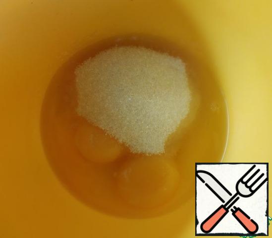 In a separate bowl, combine the eggs and sugar.