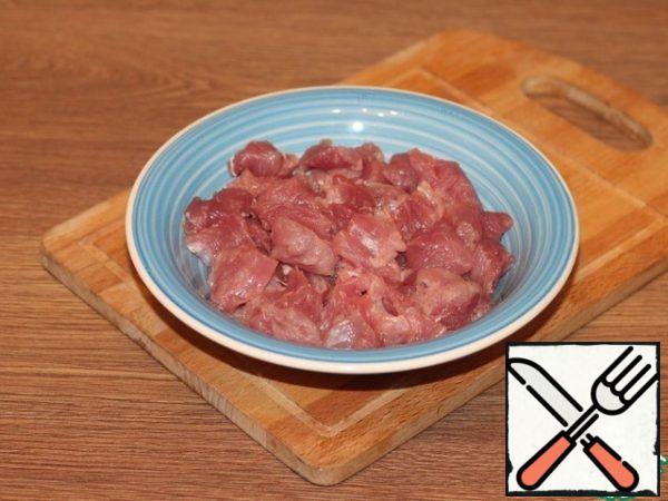 Prepared meat cut into small cubes.