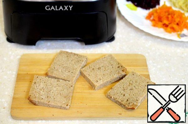 Cut the bread into rectangles or squares, cut off the crusts.