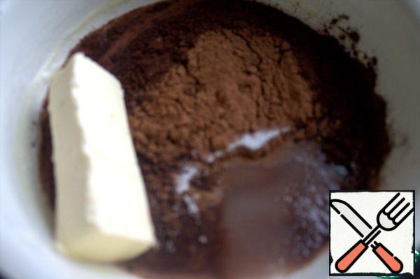 In the same bowl where I heated the milk for cookies, I will prepare the icing. Add sugar, cocoa and butter to the remaining milk.
