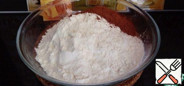 Mix in a bowl all the dry ingredients: flour, cocoa powder, spices, baking powder.
